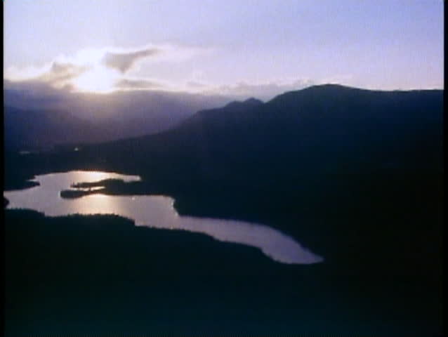 BROOKS RANGE, ALASKA, 1989, Aerial trip, POV, midnight in June, silhouette