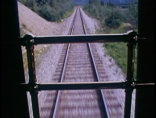 ALASKA RAILROAD, 1989, close up of retreating tracks from rear of train