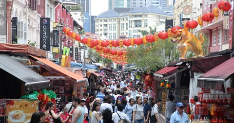 SINGAPORE, SINGAPORE - JANUARY 28, 2018 Singapore City with Crowd of People Walk on Busy Shopping Street in China Town