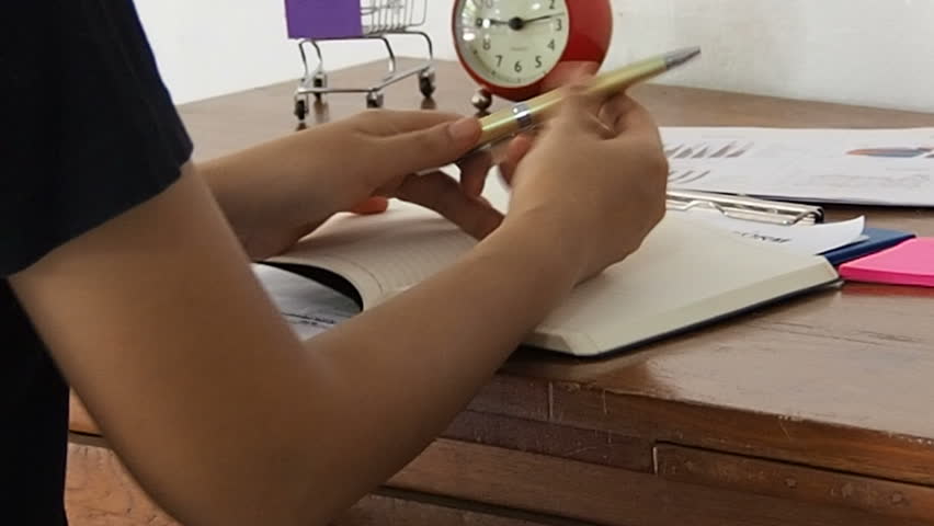 The lady is doing work, at home