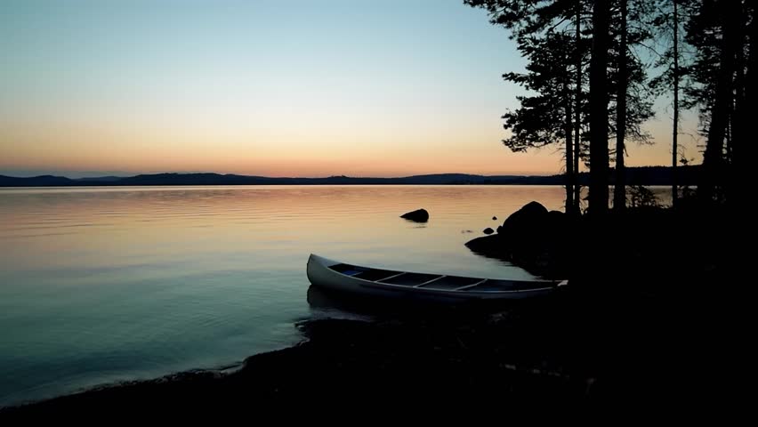 Canoe with sunset in the background