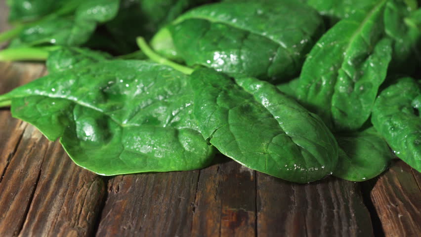 Spinach pan, old wooden table | Shutterstock HD Video #1018062979