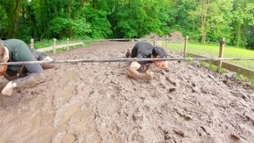 Front view of fit Caucasian men training under obstacle course at boot camp  - Powered by Shutterstock - Get 15% off with code: PIKWIZARD15