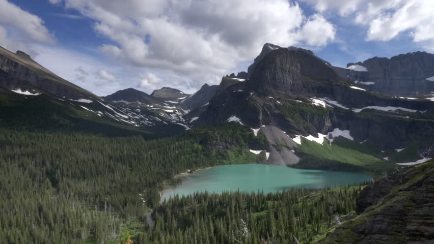 panning shot of grinnell lake at glacier national park in montana, usa