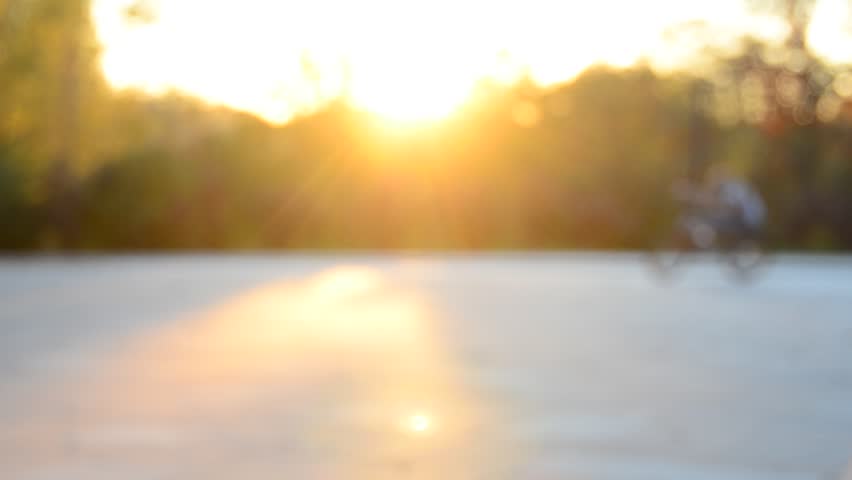 Girl riding bike in the park. Soft focus