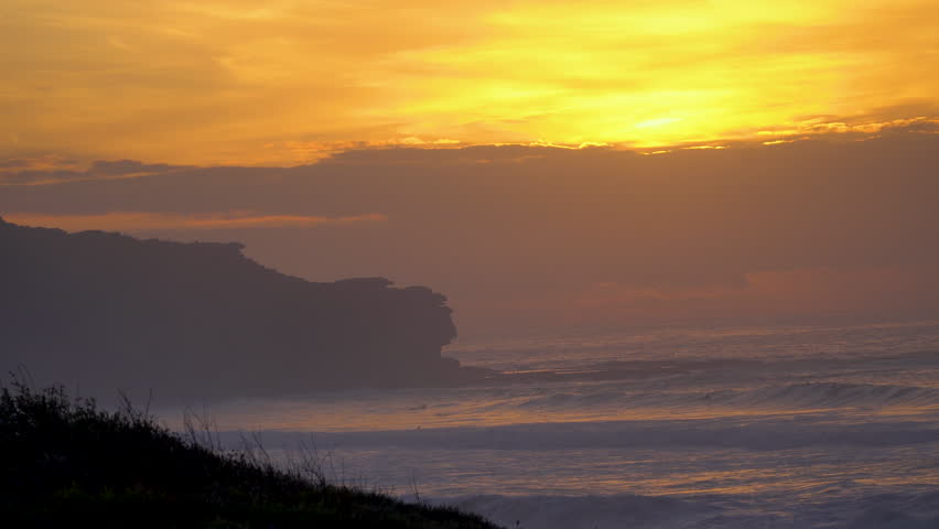 Early morning Sydney Australia beach sunrise, beach surrounds, surfers.