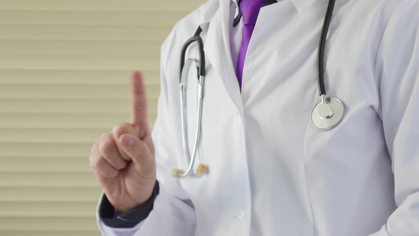 Medical doctor make no sign by his finger. He shows forbidden sign for medecine