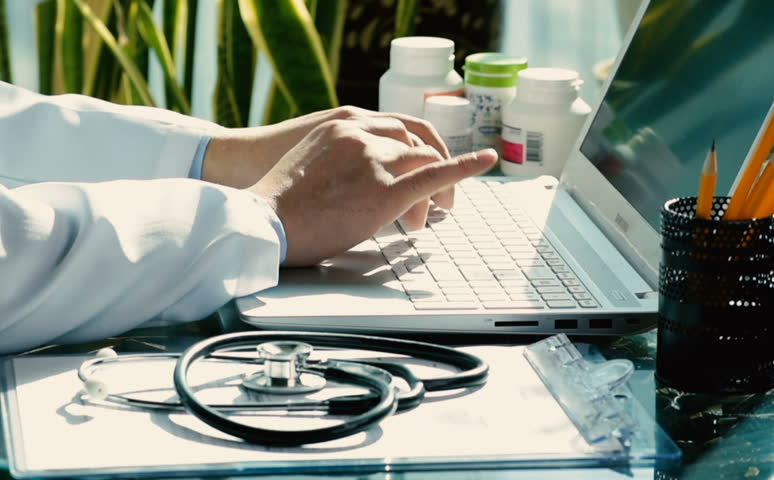 Close-up of a male doctor using a computer keyboard. Royalty-Free Stock Footage #1018108090