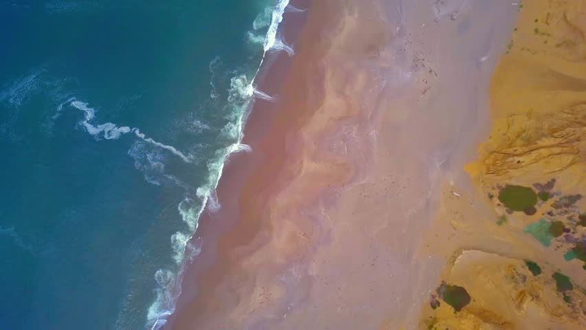 Pacific ocean coastline aerial view from above in California.