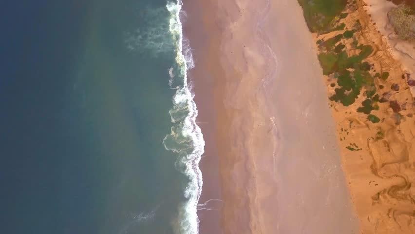 Pacific ocean coastline aerial view from above in California.
