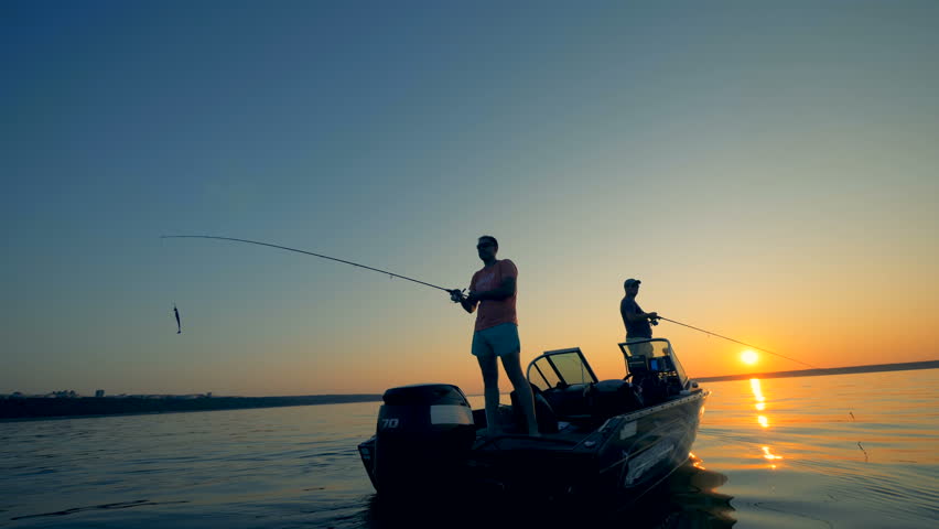 Men with a boat on a fishing trip, close up. Royalty-Free Stock Footage #1018120900