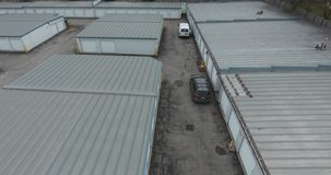 Flying Straight Up Over Storage Facility With Units And Vehicles Drone Aerial