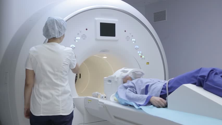 Doctor conducts patient research using x-ray device Royalty-Free Stock Footage #1018144309