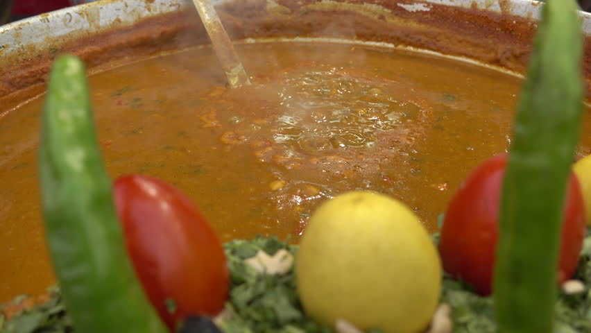Street food, Dal Bhat cooking in a big pot in Jaipur,. Dal bhat is a traditional meal from the Indian subcontinent.