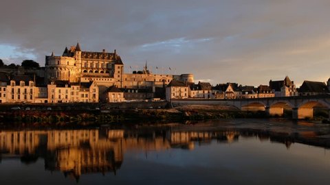 Amboise-France/Loire - October 10 2018 - The Royale d'Amboise castle reflecting in the Loire river at sunset - Motion view 