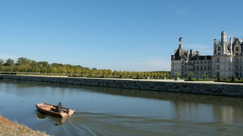 Chambord,France/Loire - October 09 2018 - The castle reflecting in the Cosson river - Motion view