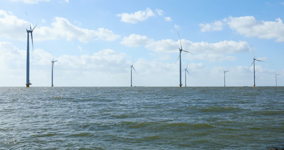 Wind turbines in a row off the coast of the Netherlands | Shutterstock HD Video #1018182181