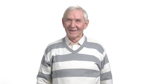 Pensioner showing thumb up, white background. Happy smiling older man with thumb up gesture isolated on white background.