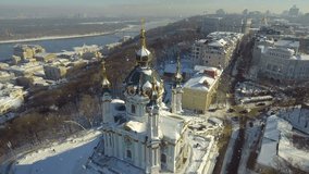 Famouse Kiev Ukraine St Andrew's Church . View from above. aerial video footage. Falling snow