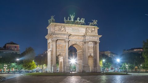 Milan City triumphal arch square panorama hyperlapse timelapse at night Italy. Sempione Gate Porta Sempione  city gate in milan.The Arch of Peace