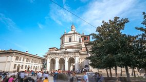 Facade of San Lorenzo Maggiore Basilica in Milan City Italy timelapse hyperlapse(Saint Lawrence the Major Cathedral) and statue of Constantine emperror in front. Milano Italy video.