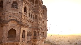 Beautiful slow motion video of some pigeons flying at sunset on the Udaipur City Palace, Rajasthan, India.