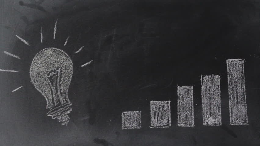 Hand draws an Arrow pointing upward over growing graph on blackboard. Successful idea concept