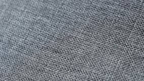 Gray upholstery fabrics surface slow pan 4K video