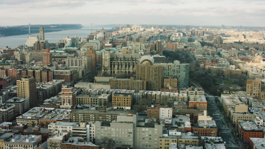 Aerial view of buildings near the Hudson River in Upper Manhattan, New York City, dim day lighting in winter. Wide shot. 4k shot with a RED camera.