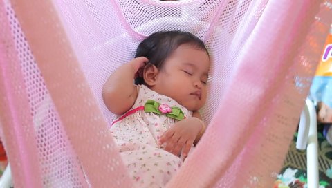 baby sleep and wake up on cloth like cradle