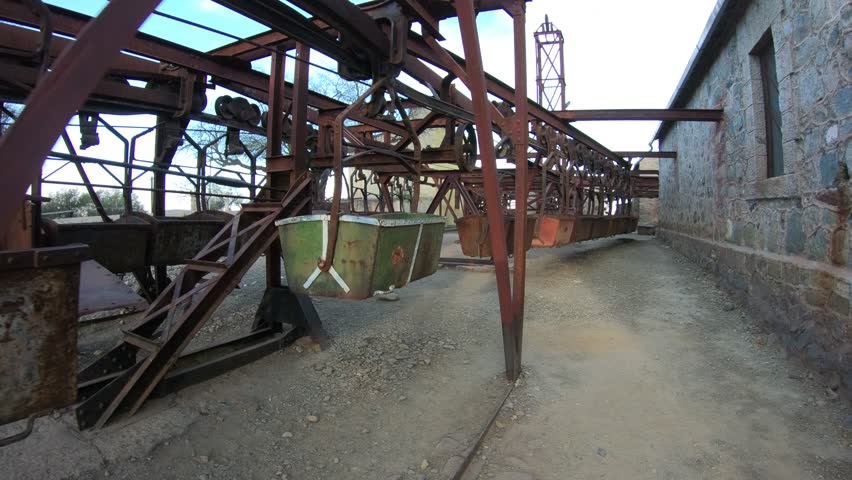 Second station, Cable Car Chilecito - La Mejicana gold mine in Famatina mountains. Walking at sunset along and above aligned hanging wagons. National industrial heritage. La Rioja