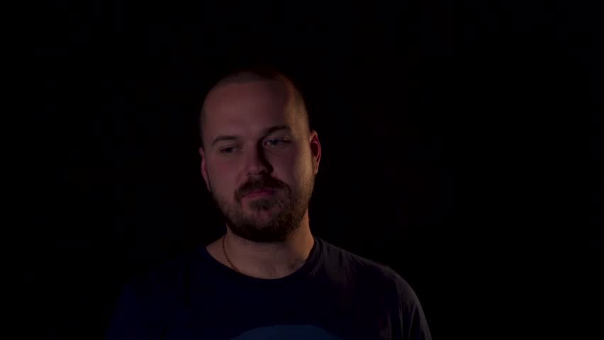 Guy On a Black Background Stock Footage Video (100% Royalty-free) 1018240429 | Shutterstock