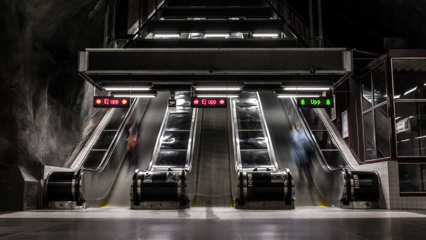 Busy underground escalators in motion Time Lapse. Subway station entrance, fast moving commuters rush hour Royalty-Free Stock Footage #1018258945