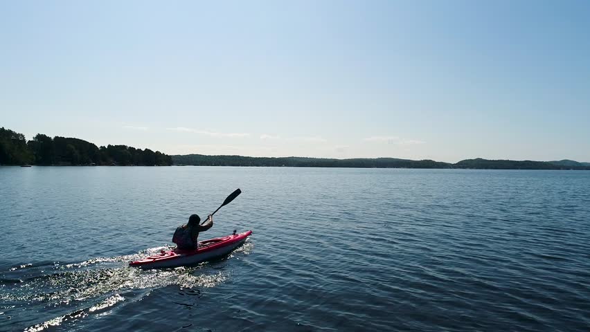 youg man do kayak with a beautiful drone wiew