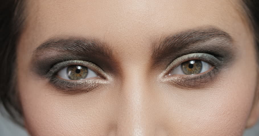 Woman Opening Her Brown Eyes With Bright Fancy Make Up And Blinking