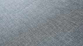 Shallow DOF gray upholstery fabrics texture 4K pan footage