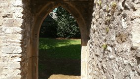 Moving backwards through castle ruins archway doors - Powered by Shutterstock - Get 15% off with code: PIKWIZARD15