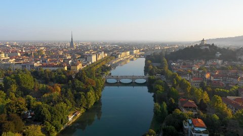 Turin skyline aerial view at morning fly over lake view of city centre and bridge, Italy.
