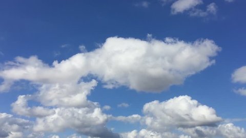 CLOUDS TIME LAPSE, MOTION CLOUD WITH BLUE SKY. Puffy fluffy white clouds blue sky time lapse move cloud background Blue clouds sky time lapse cloud Cloudscape time lapse cloudy. Seamless Loop Clouds.