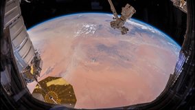 JUNE 2018: Planet Earth seen from the International Space Station with continent clouds over the earth behind a dusty window, Time Lapse. Images courtesy of NASA Johnson Space Center