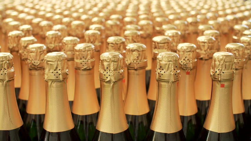 Champagne bottles on factory conveyor belt