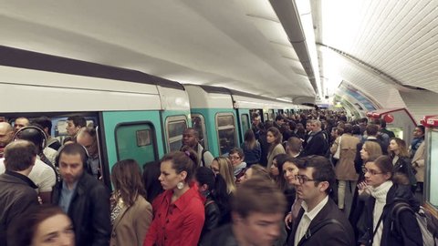 Paris, France - May 11, 2017: Paris Metro train wagon full with crowd of people during rush hour
