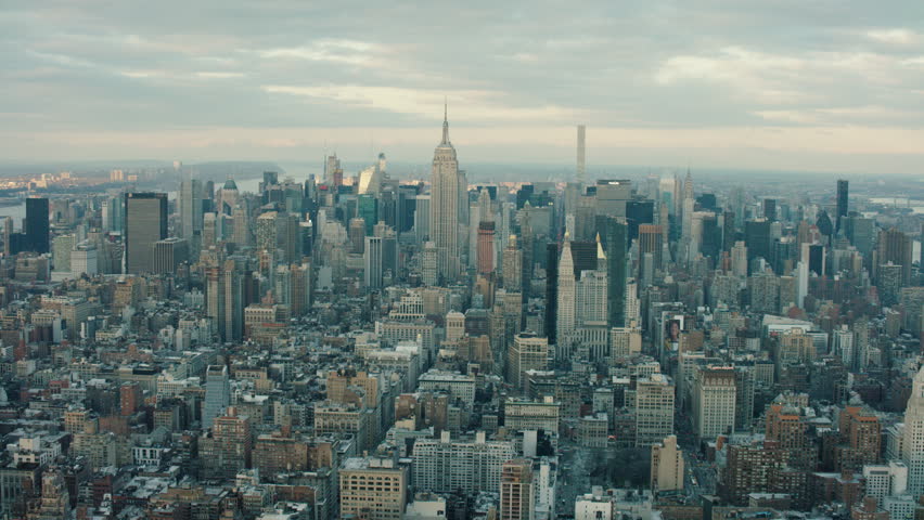 Aerial view of skyscrapers and buildings in Manhattan, New York City skyline, day light in the winter. Wide shot. 4k shot with a RED camera. Royalty-Free Stock Footage #1018311670