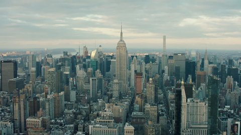 Aerial view of skyscrapers and buildings in Manhattan, New York City skyline, day light in the winter. Wide shot. 4k shot with a RED camera.