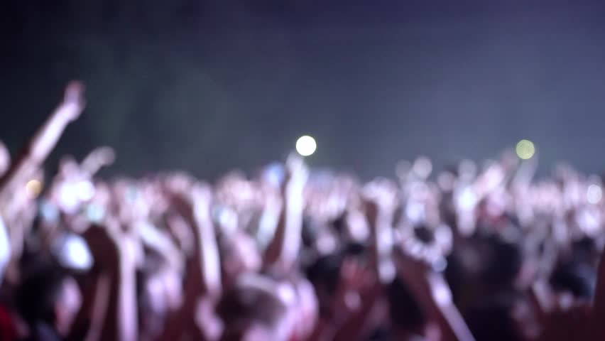 Happy people are watching an amazing musical concert. Merry fans jump and raise their hands up.
Crowd of excited fans applauding to popular band performing favorite song. A group of fans with phones Royalty-Free Stock Footage #1018316881