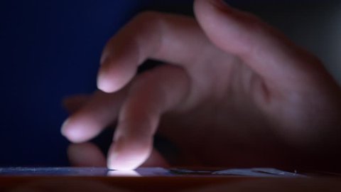 close-up, woman's fingers on the touchscreen of the smartphone. woman uses a mobile phone