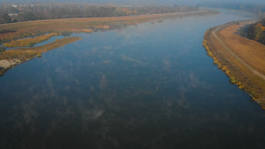 beautiful landscape with a river in a foggy morning (aerial view)