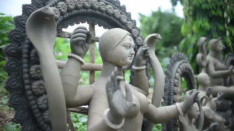Unfinished clay sculptures of Indian Gods and Goddesses are being constructed outdoor