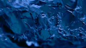 Background of rippled pattern of clean water wave  Macro blue water, abstract background This video will work great as a compositing element or background.