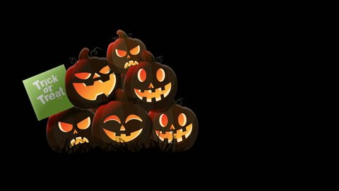 a group of six lit pumpkins sitting in the studio/background with black having waving trick or treat banner in green